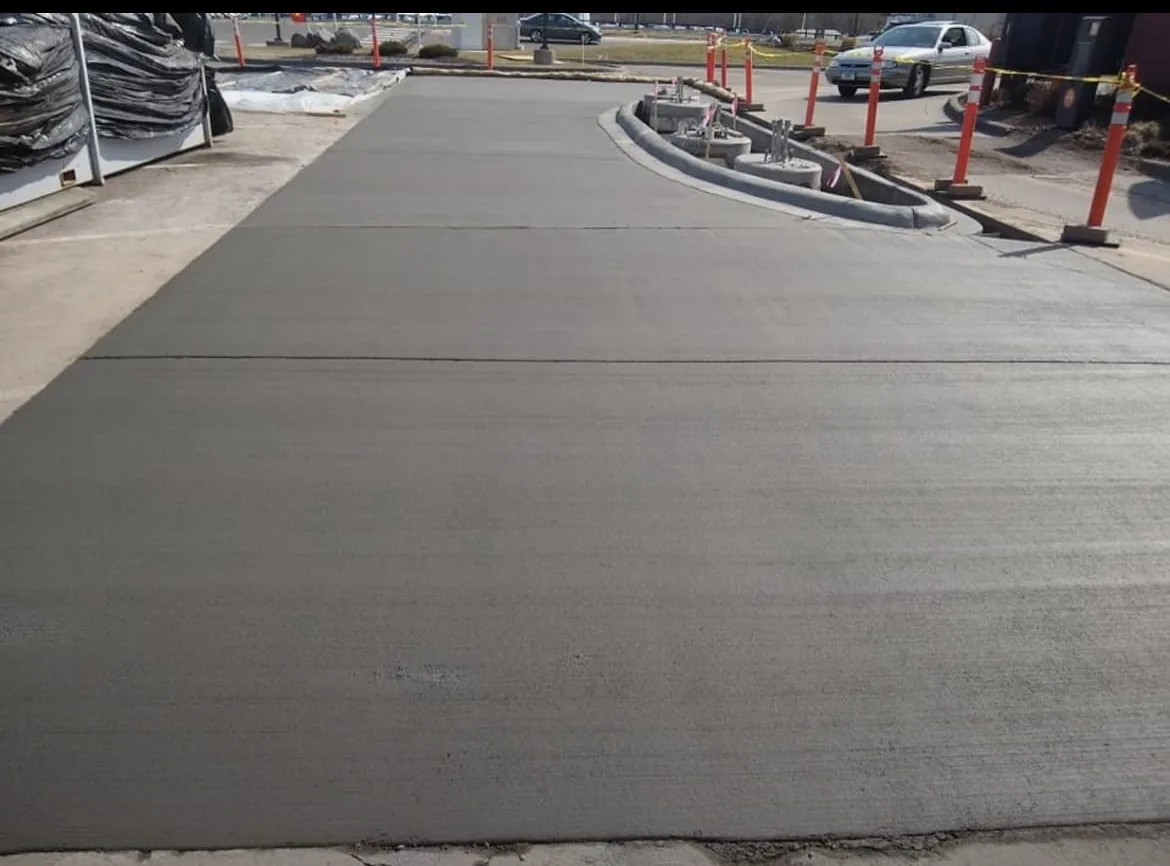 Broom-finished concrete walkway with curved edge