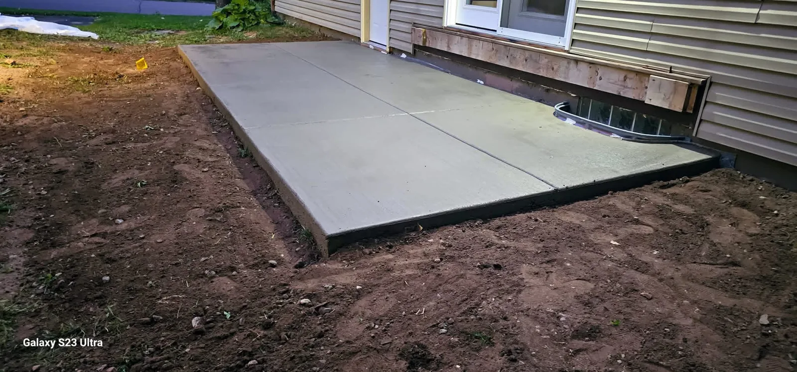 Concrete patio beside a home