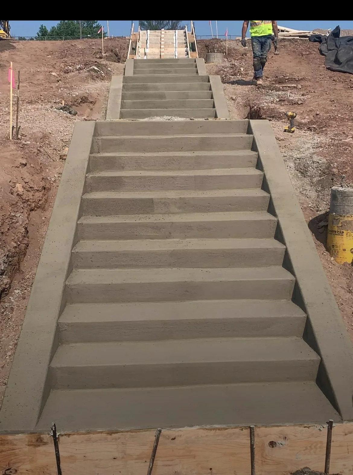 New concrete stair flight between retaining edges